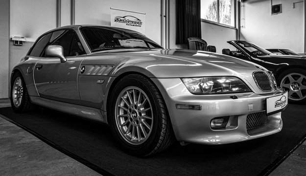 Sports car BMW Z3 shooting brake coupe, 2002 on June 08, 2019 in Paaren in Glien by Berlin, Germany. Black and white.