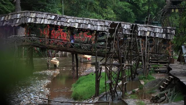 Famous Cat Cat Waterwheels in Northern Vietnam spinning in the river on a hot day in Autumn