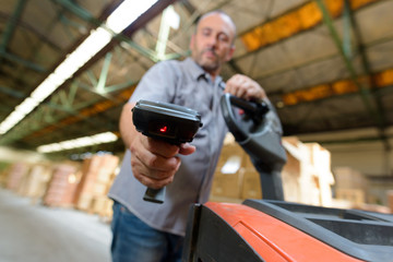 portrait of a man holding scanner