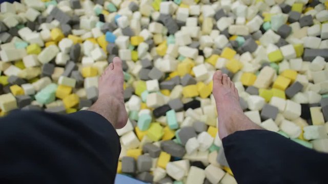 let feet dangle over the snippet pit gymnastics