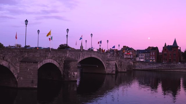 Namur, Belgium - October 10 2019:Meuse River and Pont de Jambes under the moon in the evening