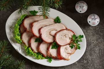 Boiled pork belly roll in onion peel with bay leaf.