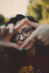 close-up portrait of young girl with glasses