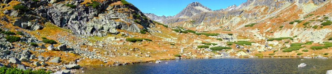 panoramic photo of the Skok lake (Pleso nad Skokom) above Skok waterfall in High Tatras National park in Slovakia © andras_csontos