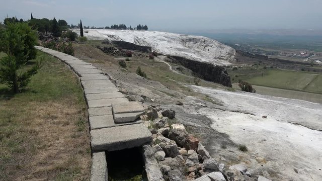Pamukkale, Denizli, Turkey - 16th of July 2019: 4K Viewing spring watercourse and sinter terraces