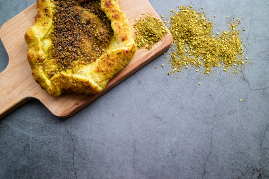 Jerusalem bread with zaatar on concrete background. Israeli cuisine. Top view.
