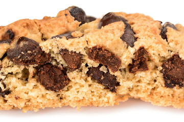 Homemade cookies. Broken cookies with chocolate chips, cut in half macro. Tasty biscuit in high resolution close-up, isolated on white background with small shadows. Homemade bakery.