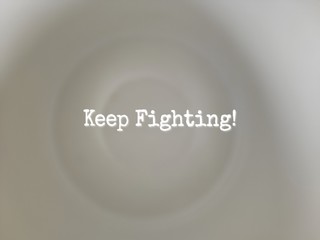 Obraz premium inspirational words of keep fighting 