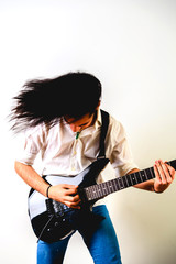 Guitarist posing with his electric guitar, white background.