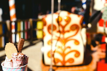 Strawberry ice cream rolled with chocolate bar and cookies, copy space.