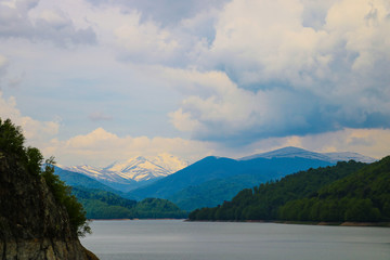 Dam and reservoir on lake Vidraru. Hydropower construction, waterworks Dam Vidrau on Transfagarash highway in Romania.