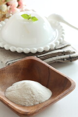 White agar powder on wooden plate for cooking image