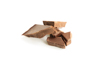 The pieces of a broken chocolate bar isolated on white