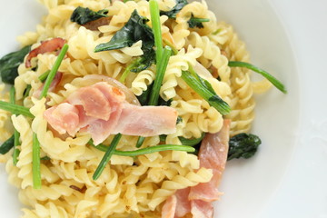 Italian food, bacon and spinach Fusilli short pasta