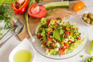 Fresh colorful vegetable salad in plate. Cooking healthy diet food	