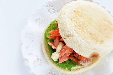 Homemade grilled salmon flake and mayonnaise in English muffin sandwich