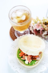 Homemade grilled salmon flake and mayonnaise in English muffin sandwich
