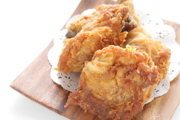 Fried chicken on wooden plate