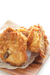 Fried chicken on wooden plate