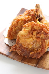 Fried chicken on wooden plate