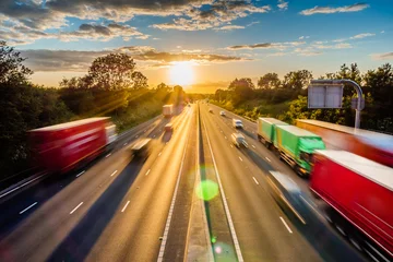 Foto op Plexiglas heavy traffic moving at speed on UK motorway in England at sunset © Jevanto Productions
