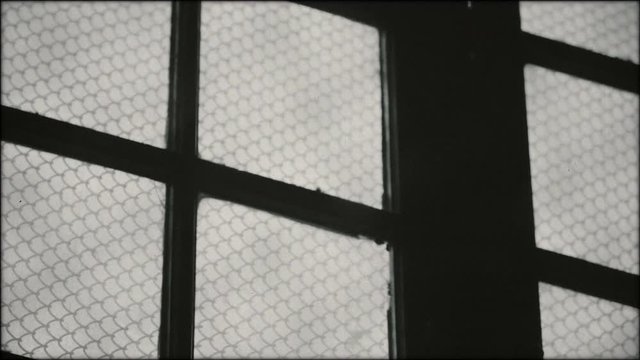 Prison building from Eastern Bloc during communist era (1940s, 1950s).
Archive, black and white footage.