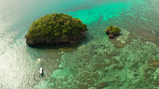 Turquoise lagoon with rocky island and corall reef, aerial view Boracay, Philippines. Summer and travel vacation concept.