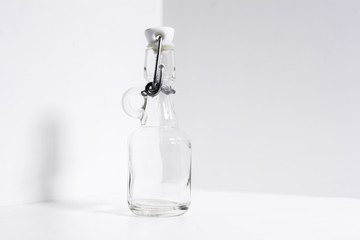 Close-up of glass thermo bottle on white background.