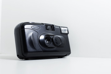 Close-up of old photo camera on white background.