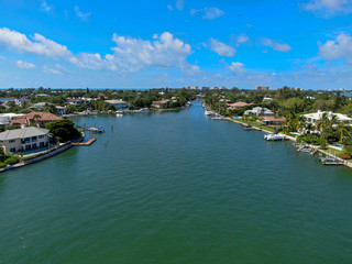 Fototapeta na wymiar Aerial view of Bay Island neighborhood, luxury villas and boat, in Sarasota, Florida, USA