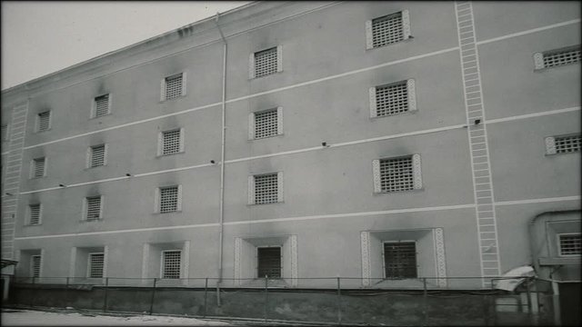Communist Prison - the main building and a wooden barrack