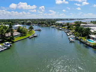 Aerial view of Bay Island neighborhood, luxury villas and boat, in Sarasota, Florida, USA