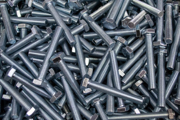 Large number of metal, steel bolts. Macro. Close-up. Background and texture.