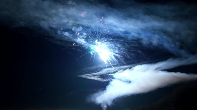 Red firework element on black background night to create video about salute on holiday and pyrotechnics happy New Year, Christmas, birthday greetings.