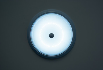 Circular bulbs mounted on the ceiling are opening for home lighting.