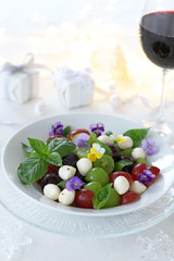Grape caprese salad on white christmas background