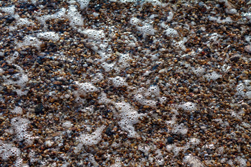 sea pebbles colored granite on the beach