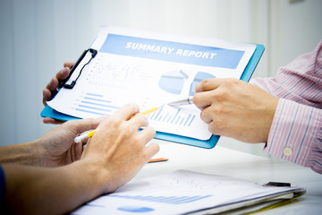 businessman working use present for Economic outlook  in office for discussing documents and ideas , with soft focus, vintage tone