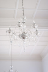 Chandelier. A soft focus of vintage luxury chandelier. Soft focus on the crystal in the middle.