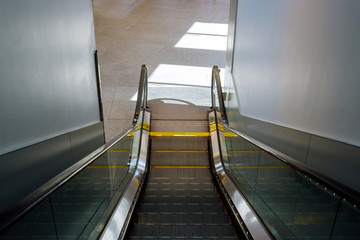 Moving escalator in the automatic stairs international airport.