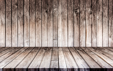 Wall and floors are made of wood. The empty room is used for decorating or displaying work.