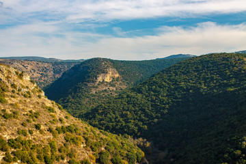 Green hills with ruins of ancient castle Monfor