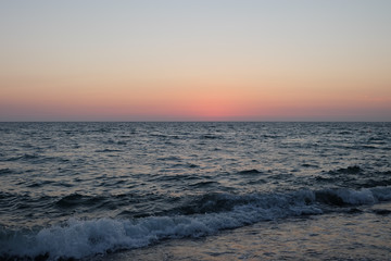 Delicate sunset on the pebble sea.