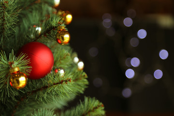 Fototapeta na wymiar Decorated Christmas tree with bokeh background.