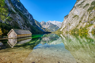 The lovely Obersee in the Bavarian Alps with a wooden boathouse