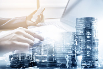 double exposure of businessman working at office with step of coins and city night, financial and investment concept