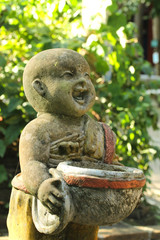 Statue of novice monks in temple Thailand.
