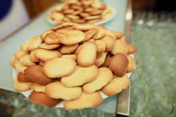 Shallow depth of field image with lots of cookies on a plate