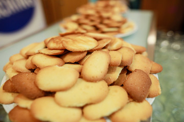 Shallow depth of field image with lots of cookies on a plate
