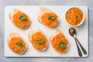Sandwiches with bread zucchini caviar tomatoes onions. Homemade vegetarian food. Copy space.